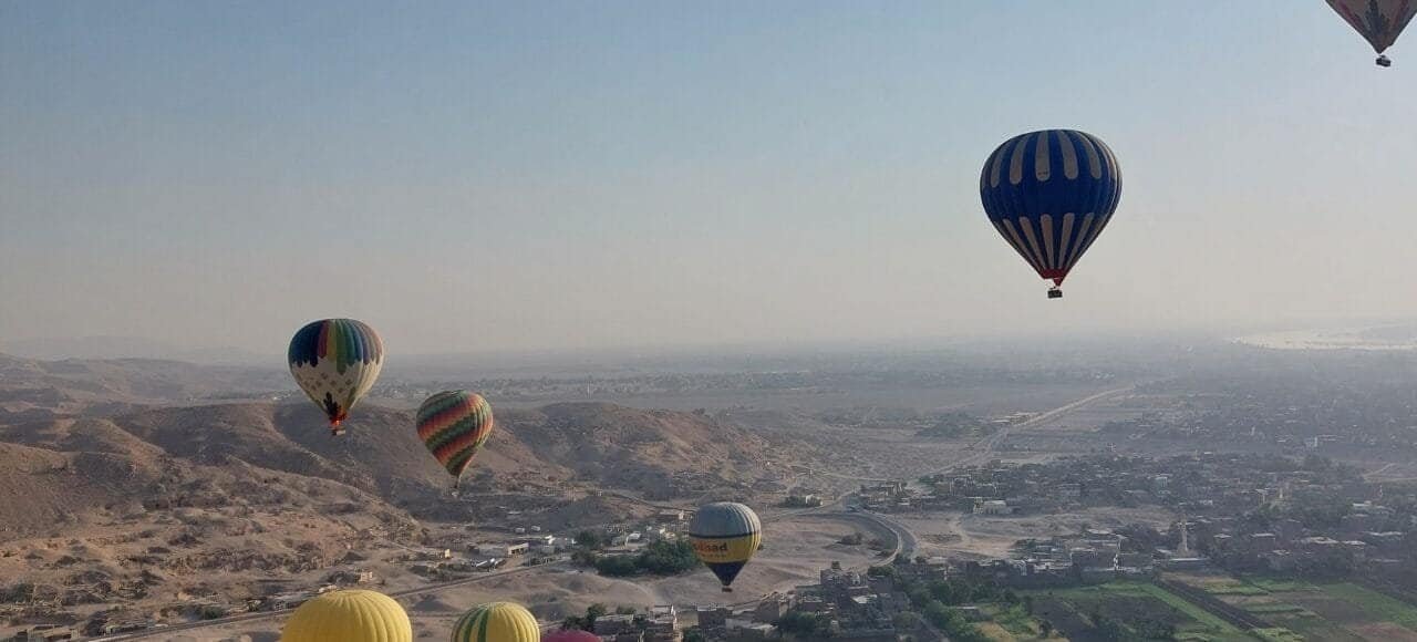 Hot air balloons over Luxor at sunrise