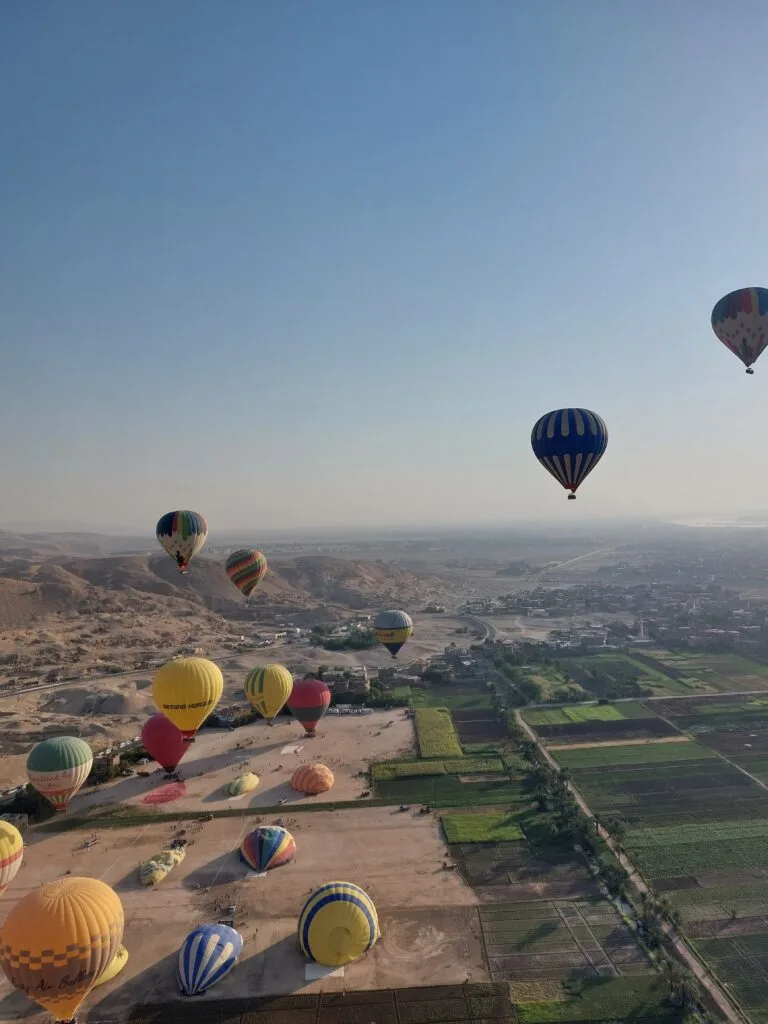 Hot air balloons over Luxor at sunrise