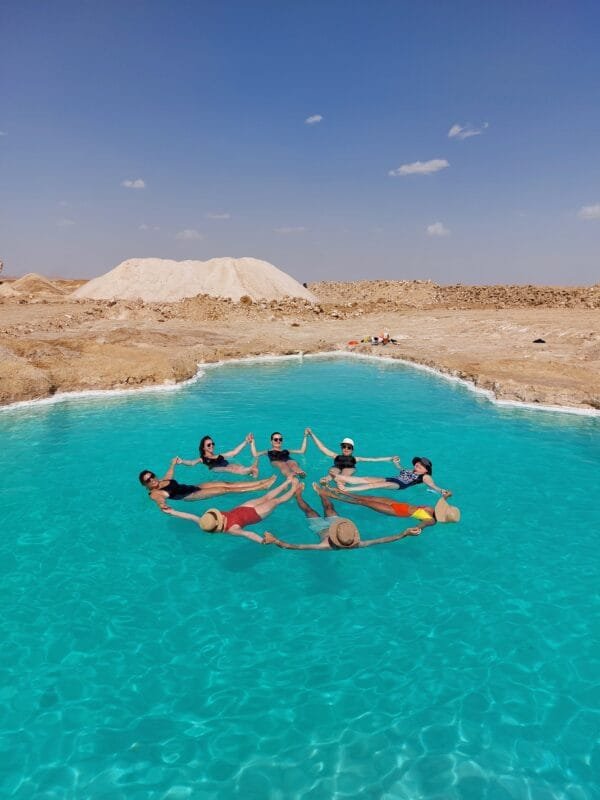Floating in Siwa salt lakes during Siwa Oasis tour