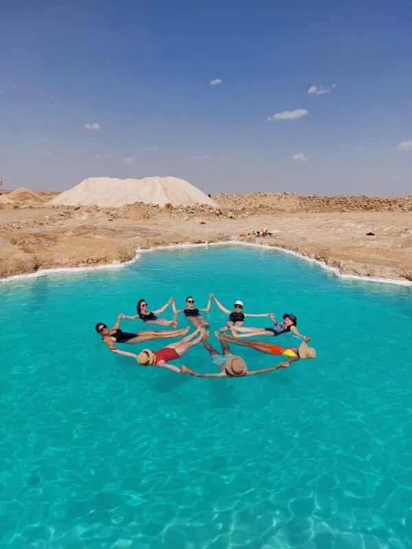 Floating in Siwa salt lakes during Siwa Oasis tour