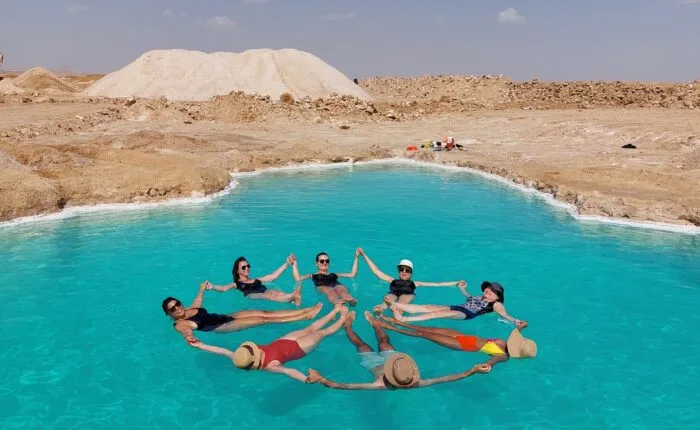 Floating in Siwa salt lakes during Siwa Oasis tour