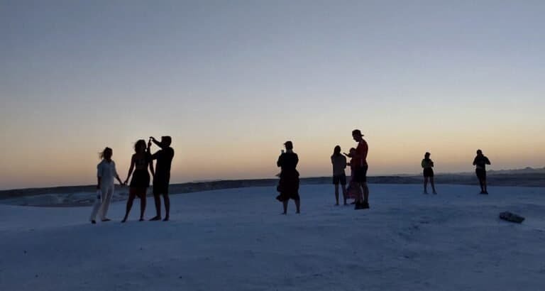 Travellers on the White Desert at dusk, one side of the Siwa vs White Desert choice
