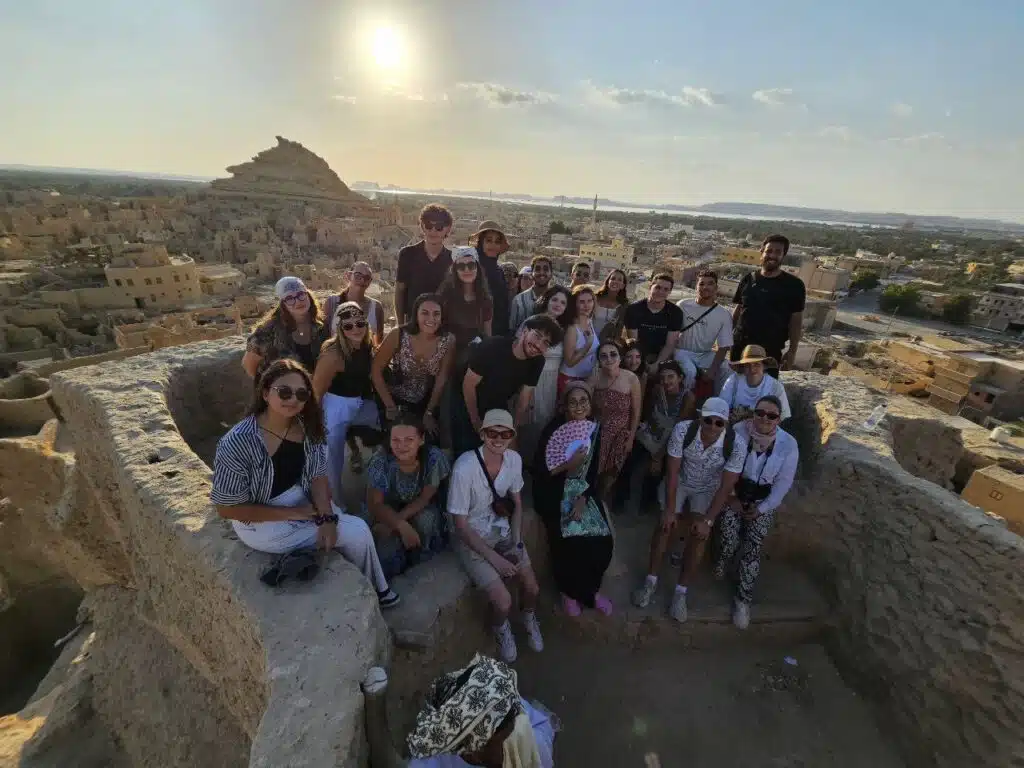 Group photo of our clients on top of Shali fortress | Siwa Oasis Travel Guide