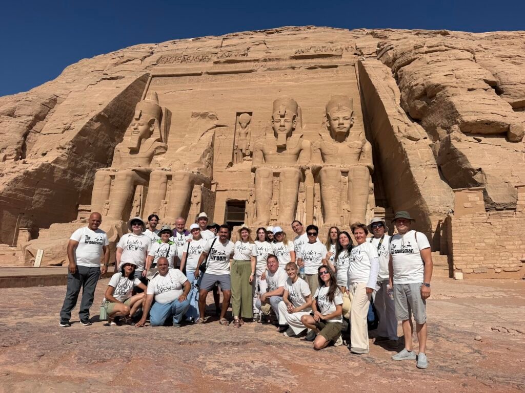 Crossroads Travel group in front of the Great Temple of Ramses II on an Abu Simbel day trip from Aswan