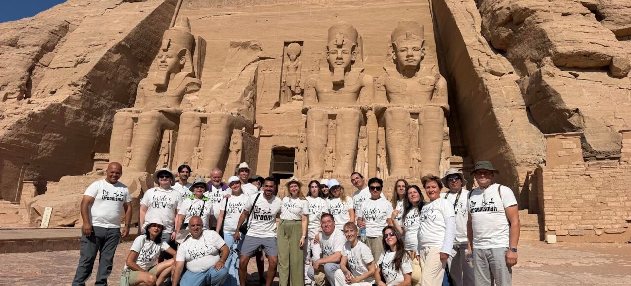 Crossroads Travel group in front of the Great Temple of Ramses II on an Abu Simbel day trip from Aswan