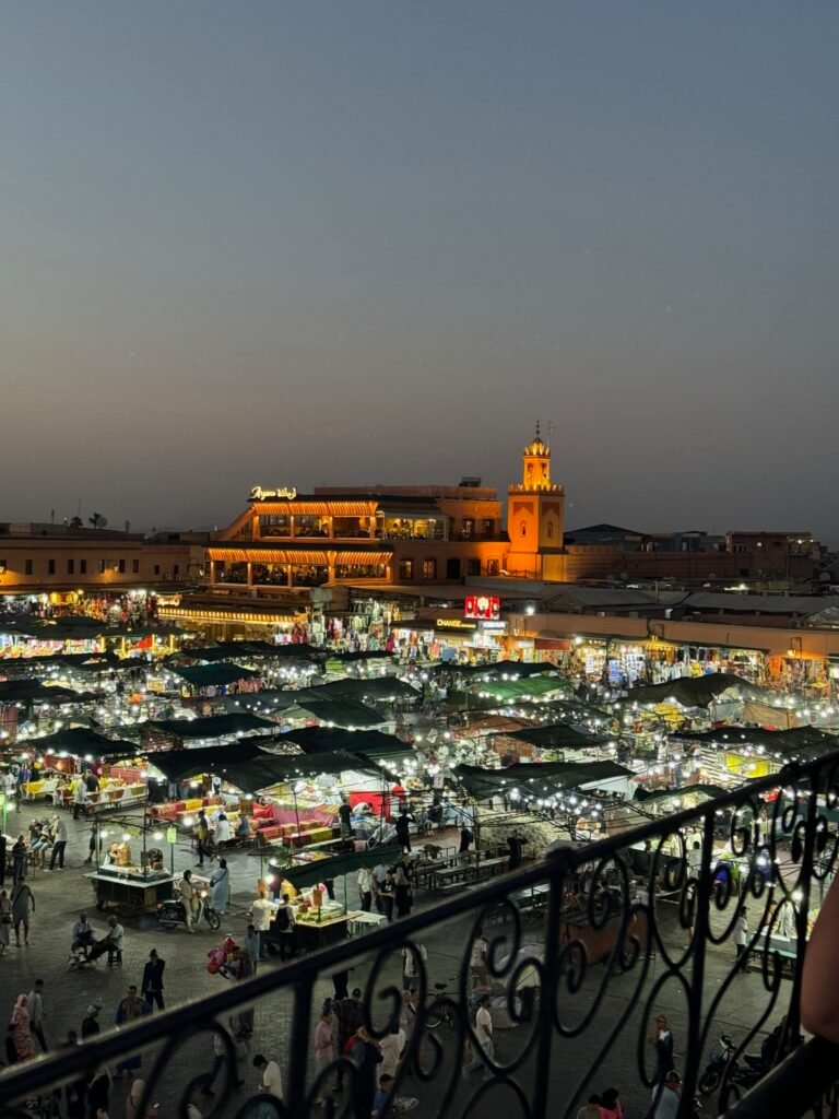 Djemaa el Fna square at dusk with the Koutoubia minaret, the last stop on a 7-day Morocco itinerary