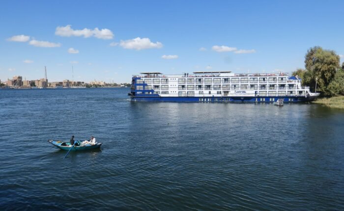 White Nile cruise ship on the river in Luxor under a blue sky
